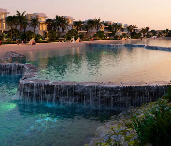 Tropical water features and man-made waterfalls within the DAMAC Islands residential community.