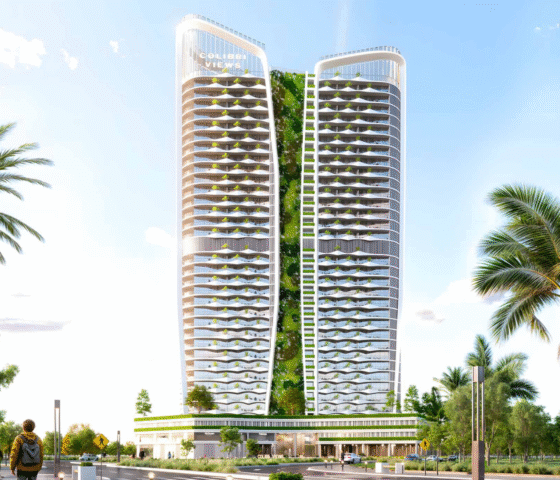 Colibri Views tower illuminated against the evening skyline