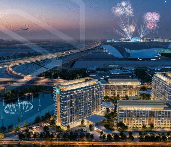 Night view of residential towers with lake, highway, and fireworks in the distance