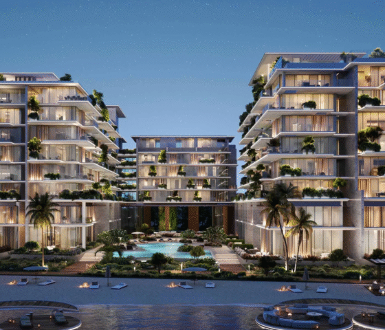Exterior view of the Silena buildings on Dubai Islands at night, showcasing tiered balconies with lush landscaping.