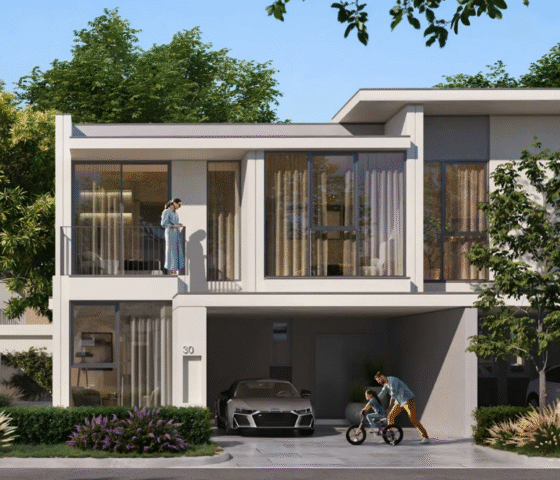 The exterior of a family townhouse in Vindera at The Valley, featuring a balcony and front garden.