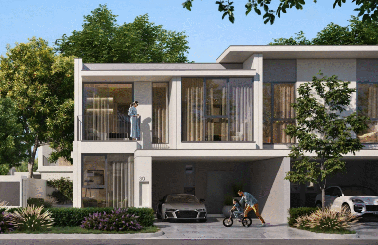 The exterior of a family townhouse in Vindera at The Valley, featuring a balcony and front garden.