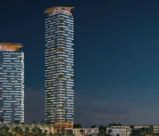 Night view of the two gleaming Soulever by Beyond towers, a luxury residential project in Dubai Maritime City.