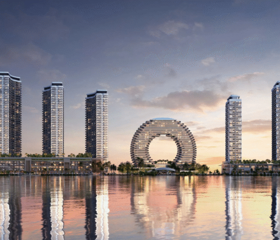 The skyline view of Sobha AquaCrest towers by Sobha Realty reflected in the water, showing the entire waterfront development.