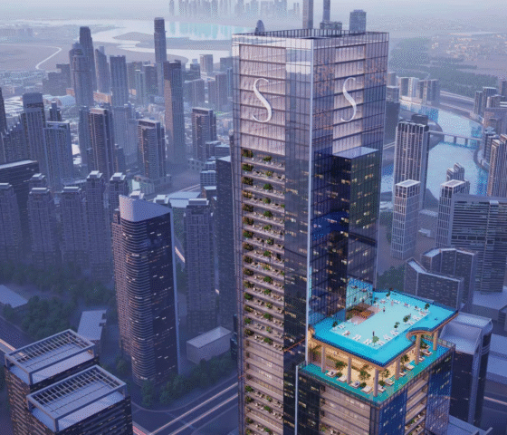 The main Sobha SkyParks skyscraper and the surrounding dense urban cityscape, viewed from above.