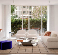 Infinity-edge rooftop pool surrounded by lounge seating