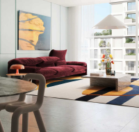 Modern living room with bold furniture, large windows, and city views