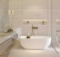 Modern master bathroom featuring soft lighting, neutral tones, and elegant double sinks.