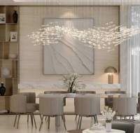 Contemporary open-plan dining area featuring a marble accent wall, built-in shelving, and bar seating.