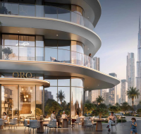 Modern luxury residential tower with outdoor café seating and Burj Khalifa in the background, Dubai.