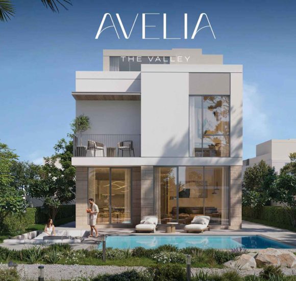 Residential view from a private balcony in The Valley, overlooking a landscaped community park with an outdoor fitness area and walking paths.