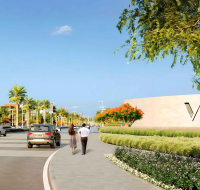 View from a private villa balcony at Avelia in The Valley, overlooking a landscaped community park with outdoor fitness equipment and walking paths.