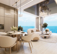 Modern open-plan living and dining area with floor-to-ceiling windows and a stunning panoramic sea view.