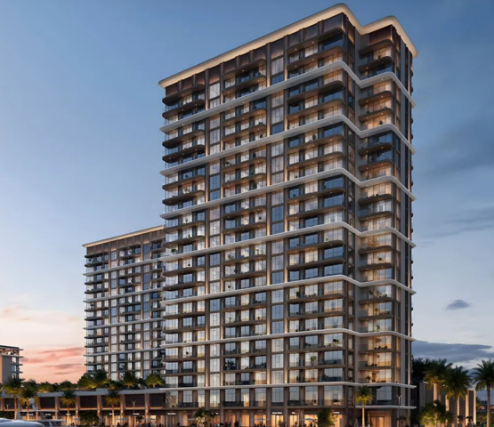 BAYSTAR residential building overlooking a marina with yachts at sunset.