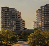 The large outdoor swimming pool area at Bellagio, complete with sun loungers, red umbrellas, and palm trees in front of its modern residential building.