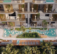 Aerial view of Belmont Park courtyard featuring swimming pools, palm trees, sunbeds, and stylish outdoor seating areas .