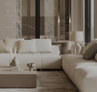 A modern living room with a large, neutral-toned sofa and minimalist furniture.