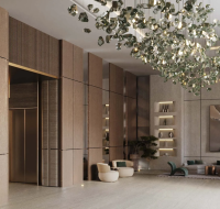 A spacious modern lobby with tall wooden panels, hanging crystal lighting, built-in shelves, and a stylish seating area.