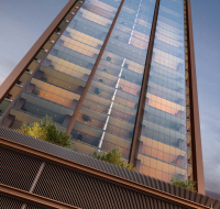 Glass tower with balcony greenery viewed against a twilight sky