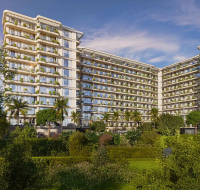 The modern exterior of California Residences, an apartment building in Dubailand surrounded by lush green landscaping.