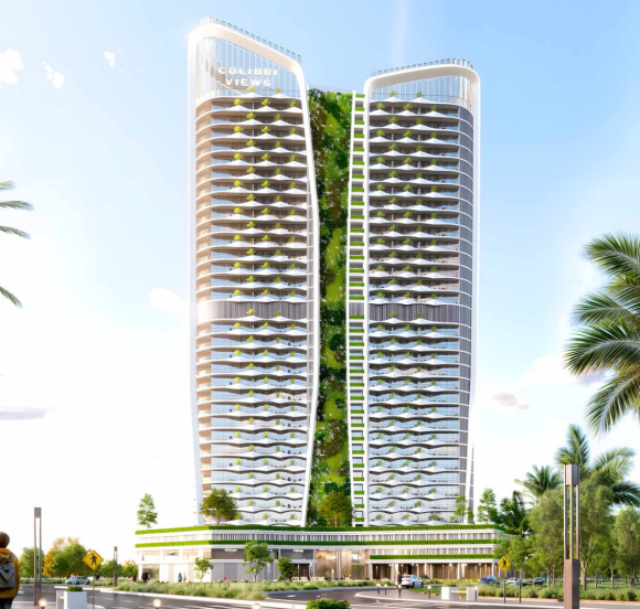 Colibri Views tower illuminated against the evening skyline