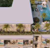 Elegant swimming pool area at Cove Edition 6 featuring relaxing lounge spaces and modern design