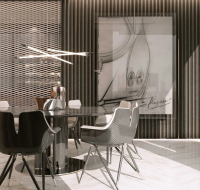 A luxury dining room featuring a round black table, carbon fiber chairs, and a large abstract artwork.
