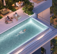 High-rise residential tower with curved glass facade, pool, and children's play area