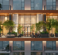 Modern building with a curved glass facade, swimming pool, and children's playground