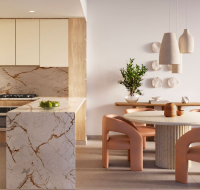 Luxurious master bedroom at Distrikt with modern decor, large bed, and balcony overlooking lush views