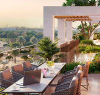 private balcony with outdoor furniture, overlooking the crystal lagoon and community park