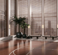 A modern indoor basketball court with elegant wooden lattice windows and a polished floor.