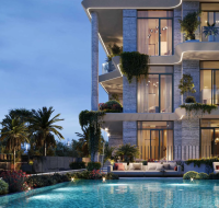 Evening view of the communal pool area , showing outdoor seating and lush landscaping.
