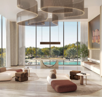 Modern lounge area with floor-to-ceiling windows and pool views.