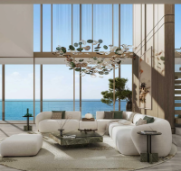 High-end interior design featuring open-plan seating area with expansive skyline outlook.