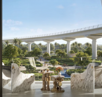Modern balcony with marble chairs overlooking a lush park and elevated monorail track