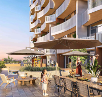 A residential outdoor amenity area with a playground and lush greenery.
