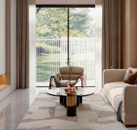 Bright and airy living space with neutral tones and a view of trees.