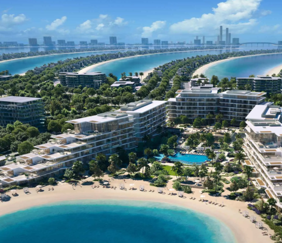 The modern architecture of Palm Central Private Residences, situated on a crescent beach with ocean views and lush landscaping.