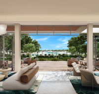 Contemporary interior seating area featuring unique light fixtures and organic design, seamlessly blending with the exterior.