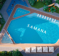 Resort-style swimming pool surrounded by sun loungers and landscaping