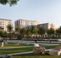 Lively community park with people relaxing, surrounded by modern buildings and green landscaping.