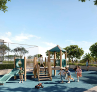 Children playing on a modern outdoor playground with slides, climbing structures, and greenery in a residential community