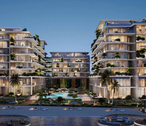 Exterior view of the Silena buildings on Dubai Islands at night, showcasing tiered balconies with lush landscaping.