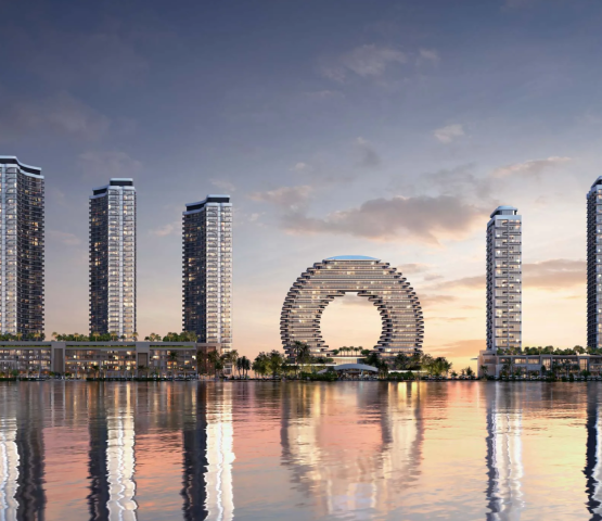 The skyline view of Sobha AquaCrest towers by Sobha Realty reflected in the water, showing the entire waterfront development.