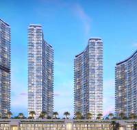 Four modern curved high-rise towers with glass façades and a landscaped podium.