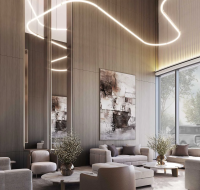 Elegant lounge with modern sofas, tall wooden walls, abstract art, and soft ambient lighting beside large windows.