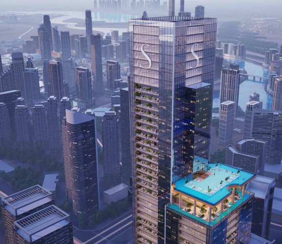 The main Sobha SkyParks skyscraper and the surrounding dense urban cityscape, viewed from above.