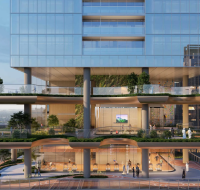 Cantilevered infinity pool amenity on a high-rise building, offering panoramic views of the city and sea at sunset.