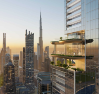 Modern high-rise building with multiple terrace gardens overlooking a city skyline at sunset.